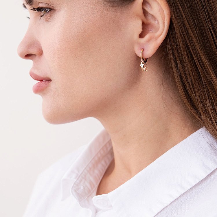 Золоті сережки - кільця "Зірочки" з фіанітами с07477 від ювелірного магазину Онікс - 1