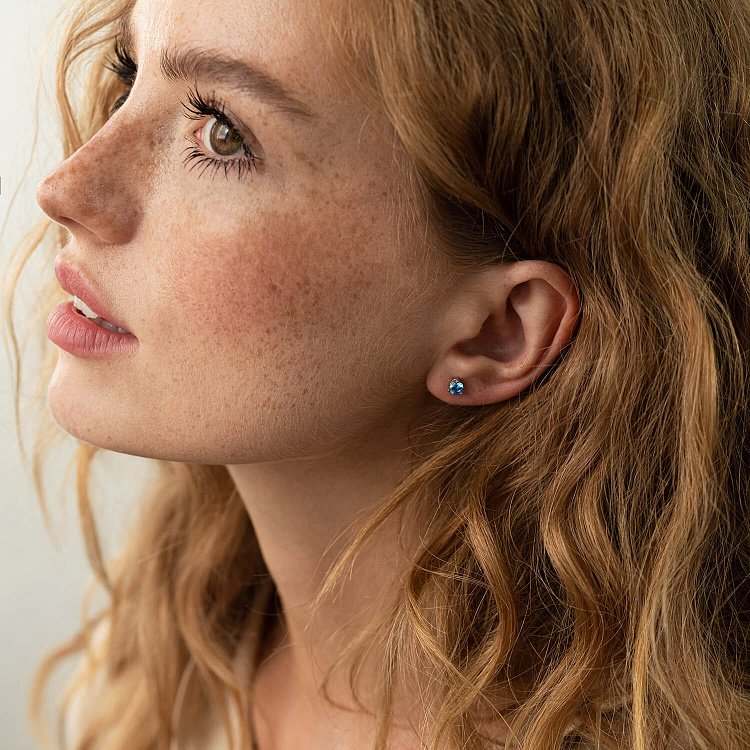 Срібні сережки - пусети (блакитне та жовте каміння) 502 від ювелірного магазину Онікс - 5