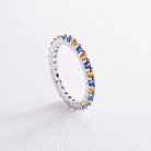 Кольцо с дорожкой голубых и желтых камней (белое золото) 815б от ювелирного магазина Оникс