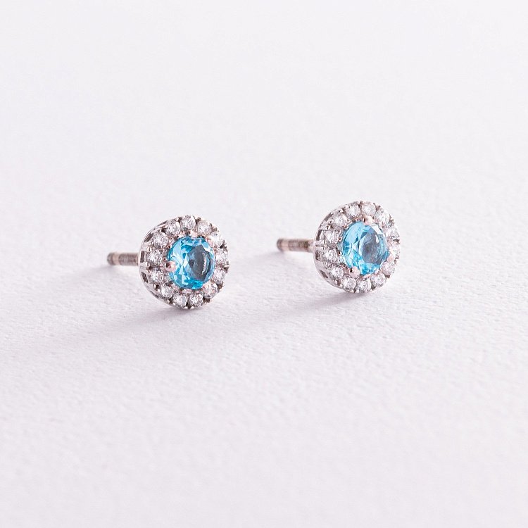 Серебряные серьги - пусеты с голубым топазом и фианитами 2112/9р-QSWB от ювелирного магазина Оникс