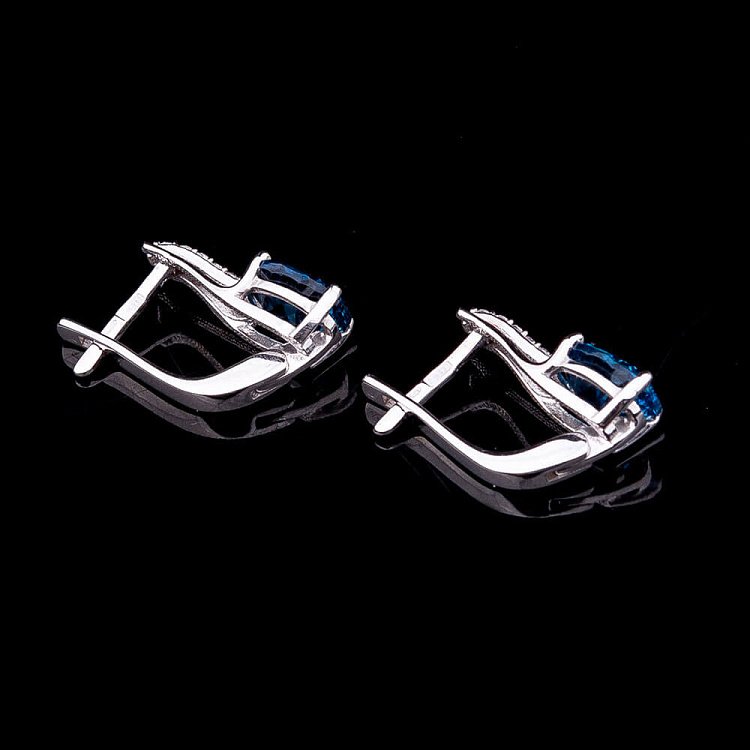 Золоті сережки з блакитним топазом і фіанітами 14050554 від ювелірного магазину Онікс - 1