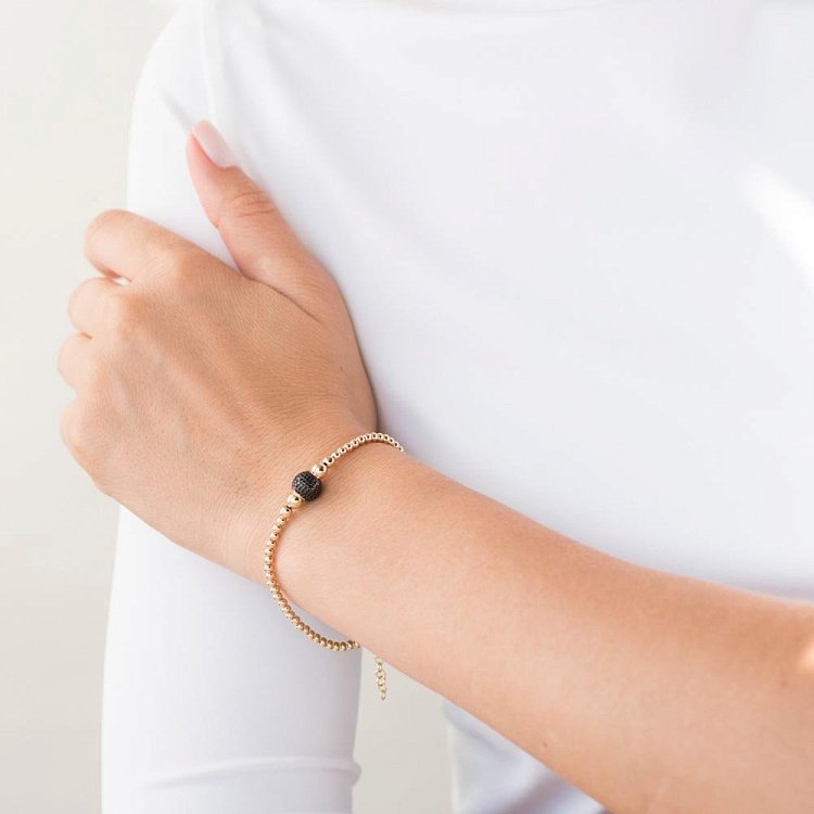 Золотий браслет "Кульки" (чорні фіаніти) б03585 від ювелірного магазину Онікс