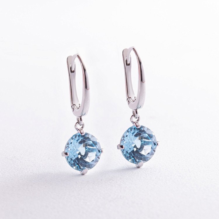 Золоті сережки "Захоплення" з блакитним топазом с08003 від ювелірного магазину Онікс