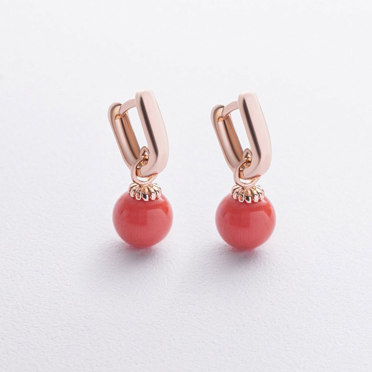 Сережки з коралом (червоне золото) с08755 від ювелірного магазину Онікс
