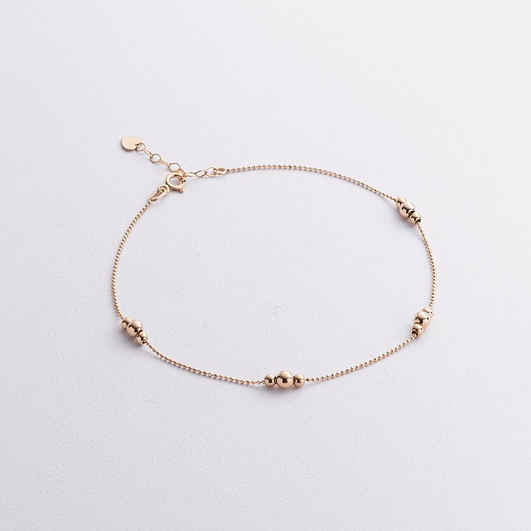 Золотий браслет "Кульки" на ногу б05554 від ювелірного магазину Онікс