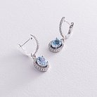 Срібні сережки з блакитними топазами і фіанітами 121361 от ювелирного магазина Оникс