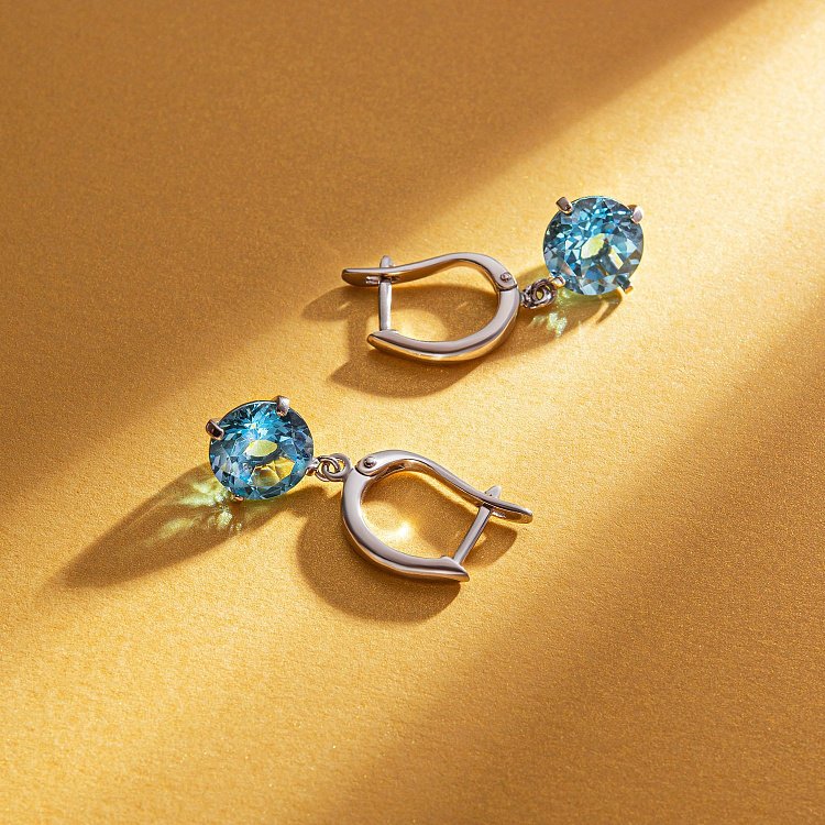 Золоті сережки "Захоплення" з блакитним топазом с05290 від ювелірного магазину Онікс - 4