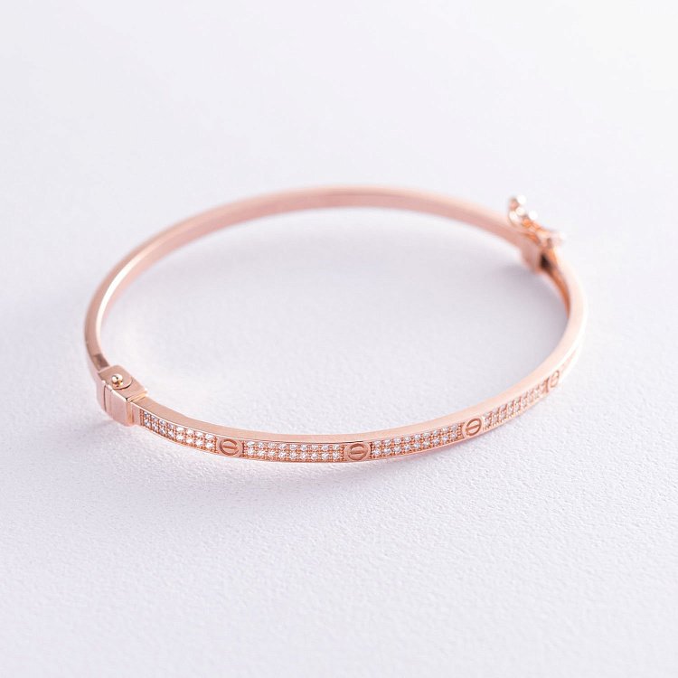 Жорсткий золотий браслет з фіанітами б04486 від ювелірного магазину Онікс