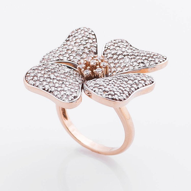 Золота каблучка з фіанітами "Квітка" к01870 Золота каблучка з фіанітами "Квітка" к01870 від ювелірного магазину Онікс