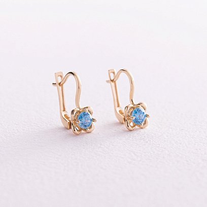 Дитячі золоті сережки "Квіточки" (блакитні фіаніти) с08064г