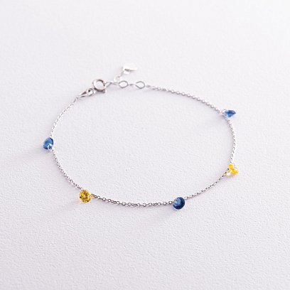 Браслет "Українка" у білому золоті (сині та жовті фіаніти) б05119