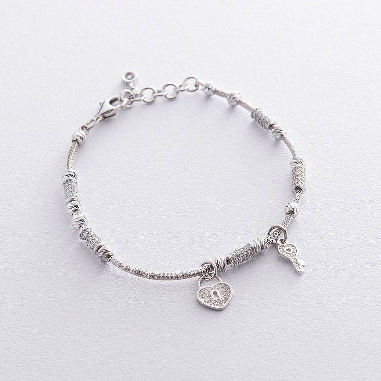 Золотий браслет "Сердечко з ключиком" (фіаніт) б04012 від ювелірного магазину Онікс