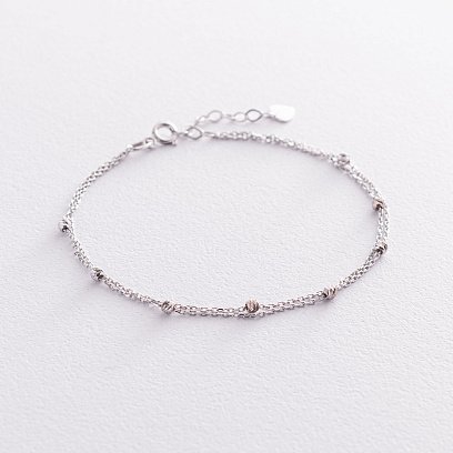 Подвійний браслет "Кульки" в білому золоті б04705