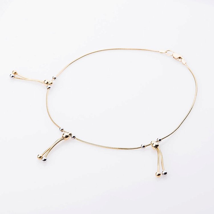 Золотий браслет на ногу з кульками б01806 від ювелірного магазину Онікс