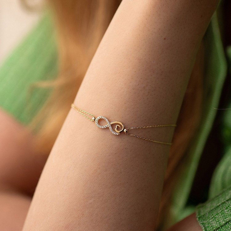 Браслет "Нескінченність" у жовтому золоті (фіаніти) б05307 від ювелірного магазину Онікс - 1