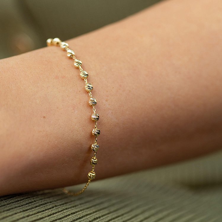 Браслет "Кульки" у жовтому золоті б05350 від ювелірного магазину Онікс - 1