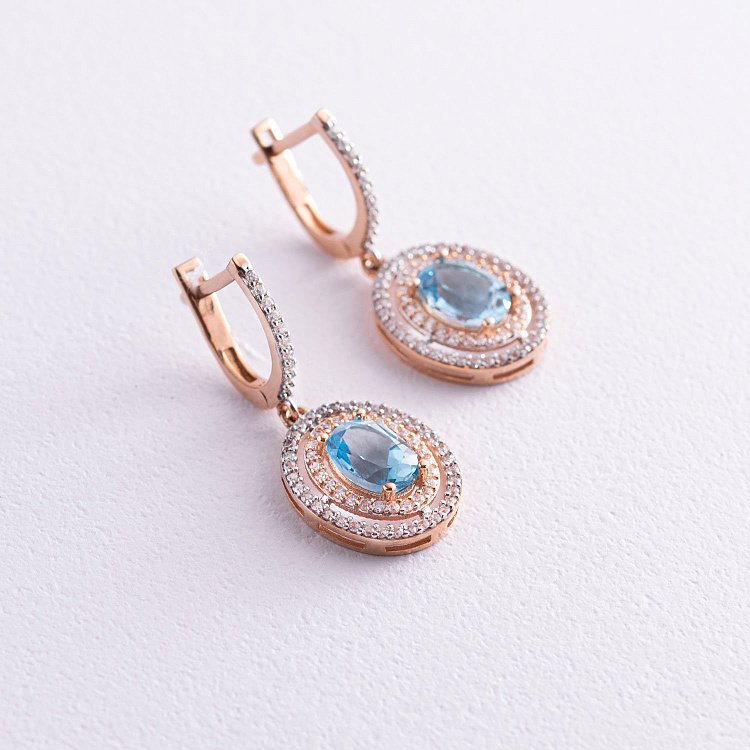 Золотые серьги с голубым топазом и фианитами с04187 от ювелирного магазина Оникс