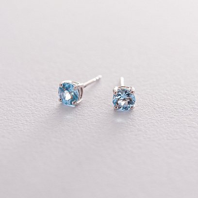 Золоті сережки-пусети з блакитним топазом сб0112gl