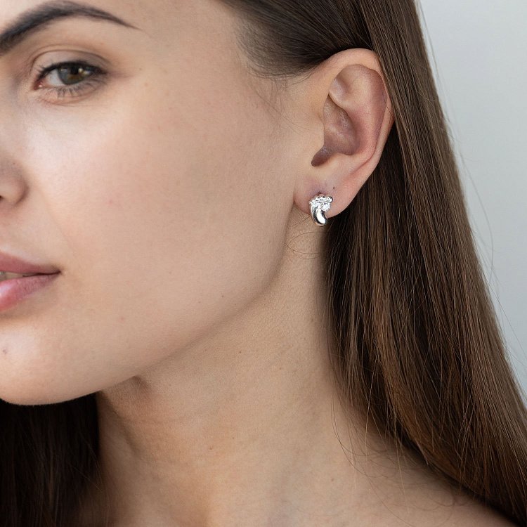 Срібні сережки "Ніжки немовляти" з фіанітами 121642 від ювелірного магазину Онікс - 1