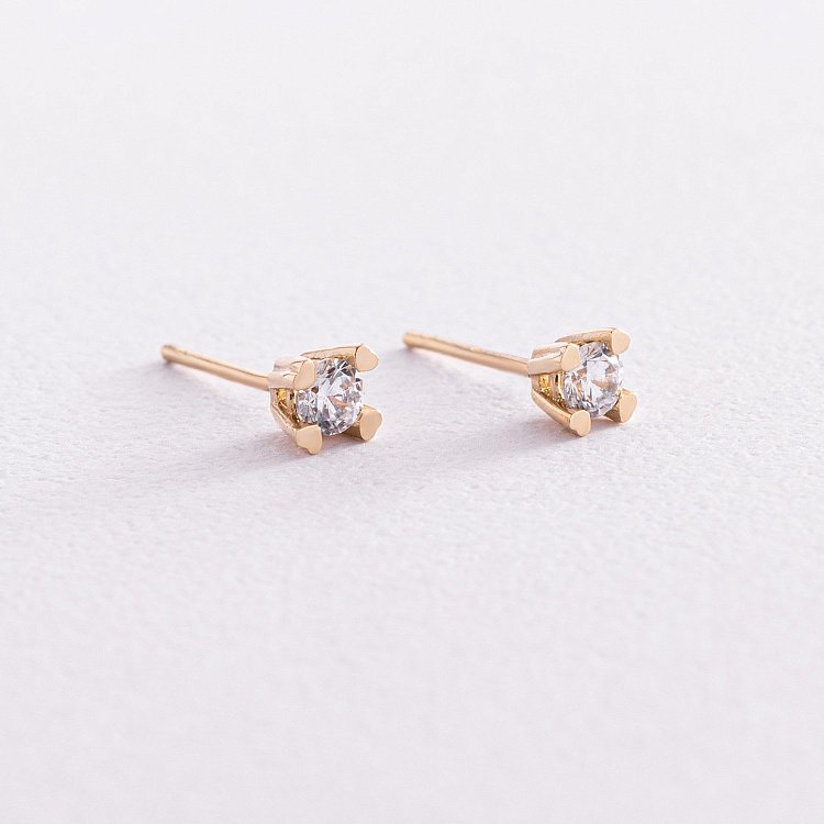 Золотые серьги - пусеты с фианитами с06150 от ювелирного магазина Оникс