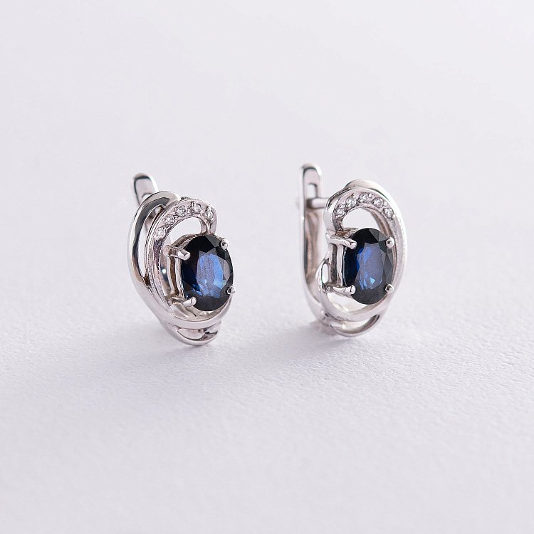 Золоті сережки (сапфір, діамант) 14110206 від ювелірного магазину Онікс