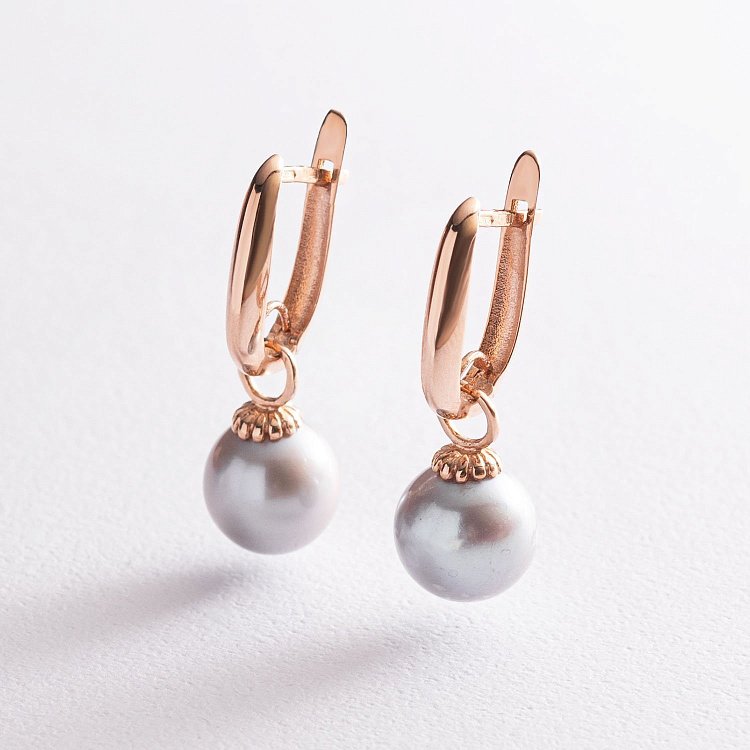 Золоті сережки з перлами с07530 від ювелірного магазину Онікс