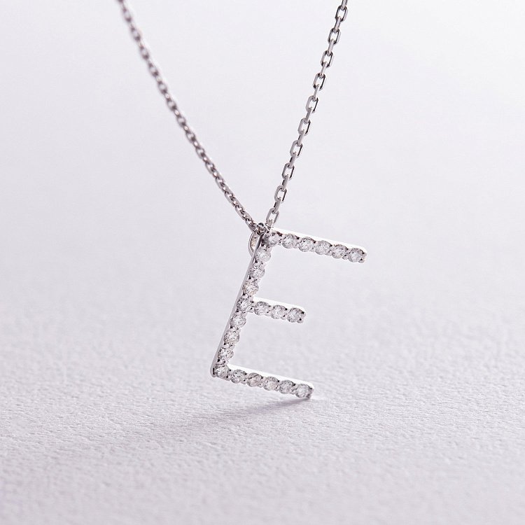 Золоте кольє з літерою "Е" з діамантами 134111121 від ювелірного магазину Онікс