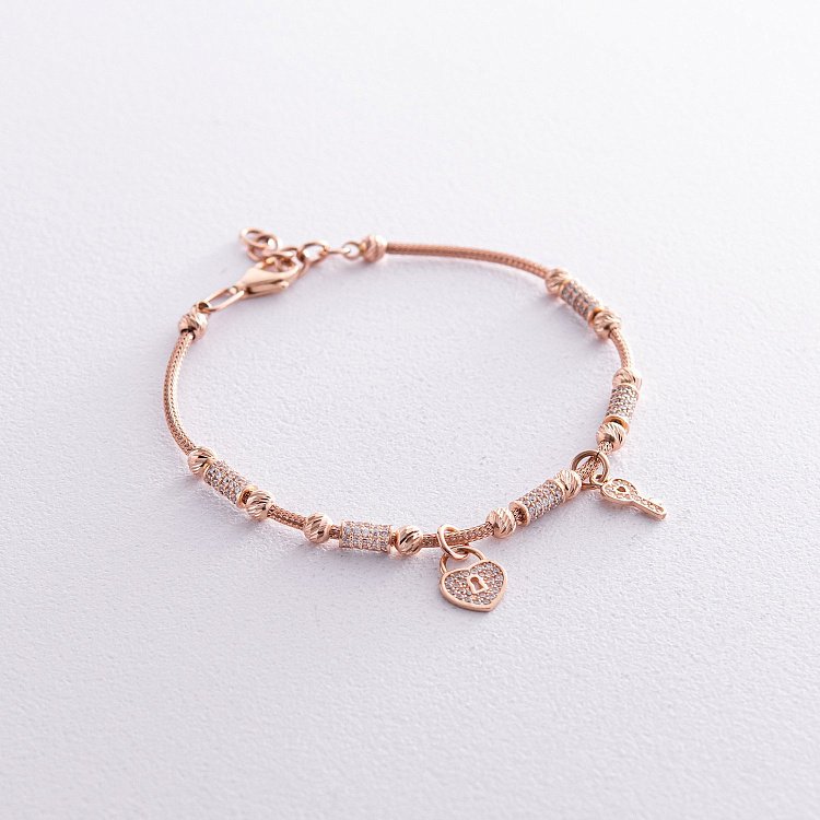 Золотий браслет "Сердечко з ключиком" (фіаніт) б04007 від ювелірного магазину Онікс