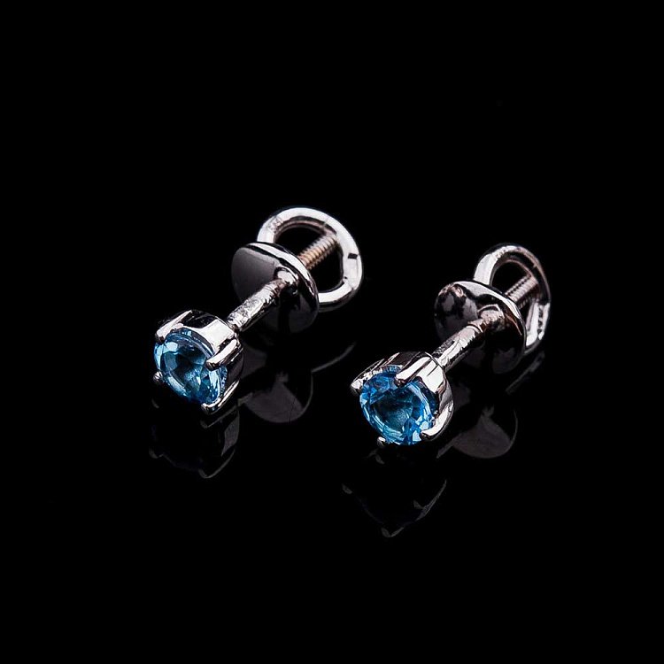 Золоті сережки-пусети з блакитним топазом СТД2-154 від ювелірного магазину Онікс