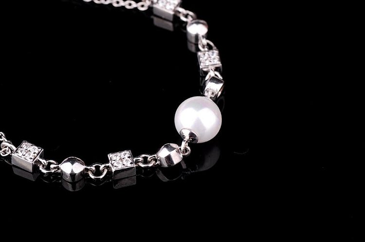 Срібний браслет з культивованими прісноводним перлами 14773 від ювелірного магазину Онікс - 1