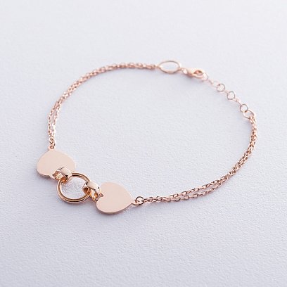 Подвійний золотий браслет "Два серця" б04311