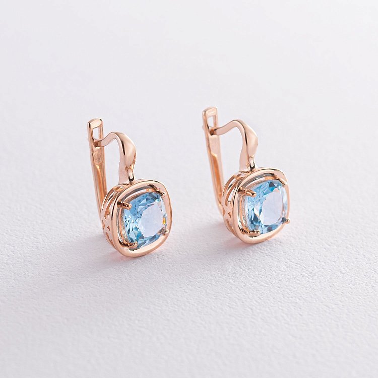 Золотые серьги с голубым топазом с05156 от ювелирного магазина Оникс