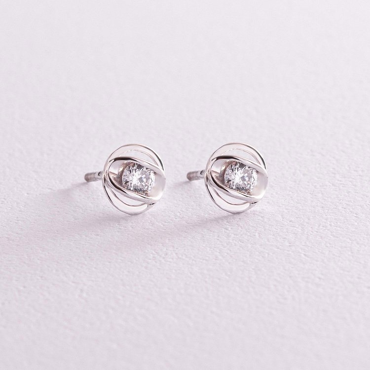 Срібні сережки - пусети з фіанітами 12850 від ювелірного магазину Онікс