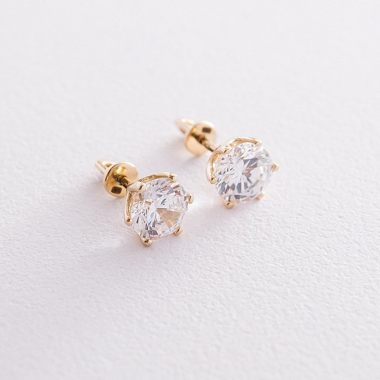 Золоті сережки-пусети з фіанітами с05700 від ювелірного магазину Онікс