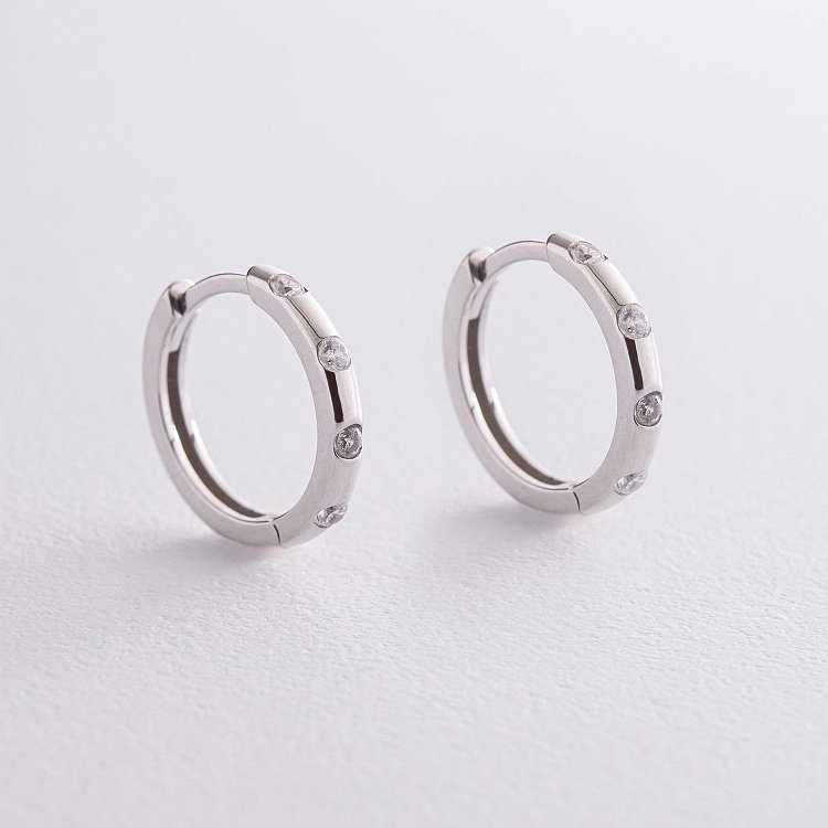 Срібні сережки - кільця (фіаніти) OR110510 від ювелірного магазину Онікс