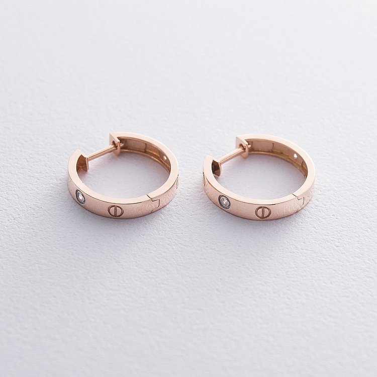 Золоті сережки - кільця з фіанітами с06243 від ювелірного магазину Онікс