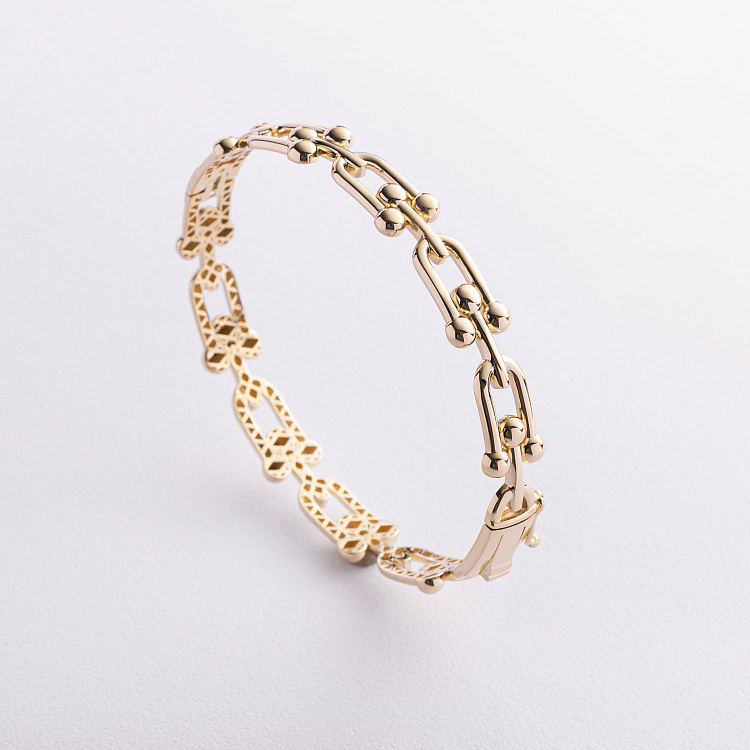 Жорсткий браслет "Фантазія" у жовтому золоті б05834 від ювелірного магазину Онікс