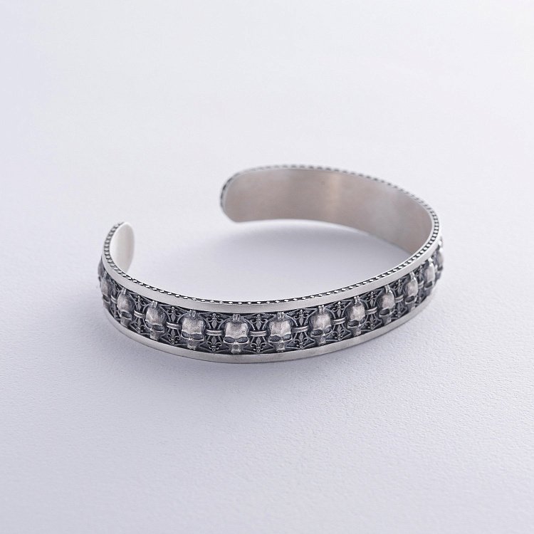 Чоловічий срібний браслет з черепами 1225 від ювелірного магазину Онікс