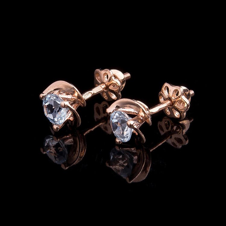 Золоті сережки-пусети з блакитним топазом с01797 від ювелірного магазину Онікс - 1