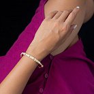 Жорсткий золотий браслет з фіанітами б04491 от ювелирного магазина Оникс - 1