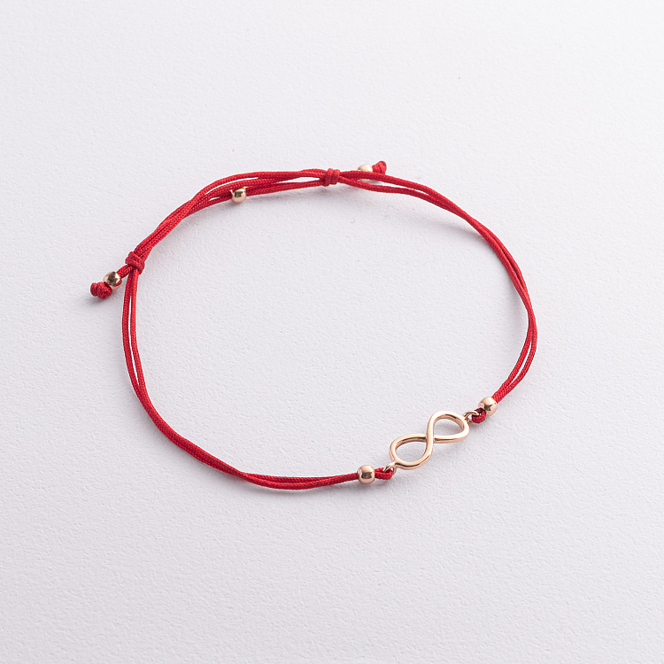 Золотий браслет "Нескінченність" з червоною ниткою б02719 від ювелірного магазину Онікс