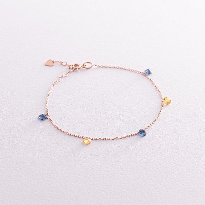 Золотий браслет "Українка" (сині та жовті фіаніти) б05144