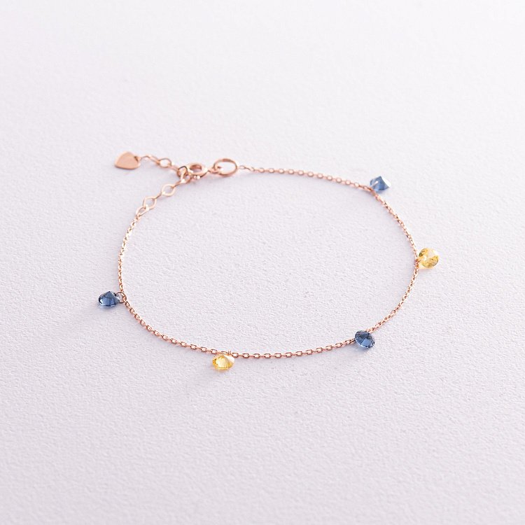 Золотий браслет "Українка" (сині та жовті фіаніти) б05144 від ювелірного магазину Онікс