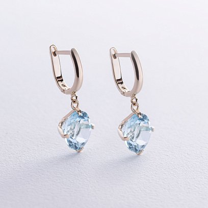 Золоті сережки "Захоплення" з блакитним топазом с08700