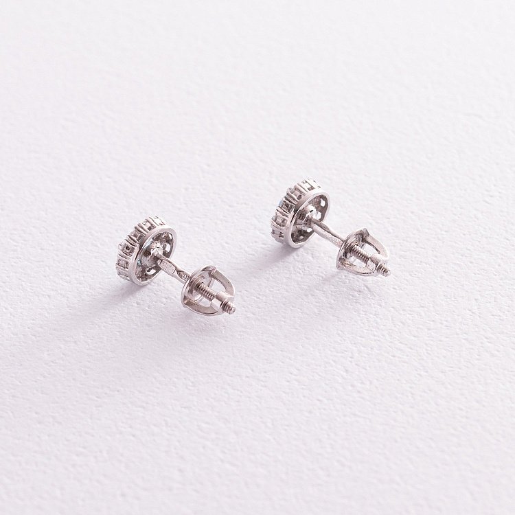 Срібні сережки - пусети з блакитним топазом і фіанітами 2112/9р-QSWB від ювелірного магазину Онікс - 2