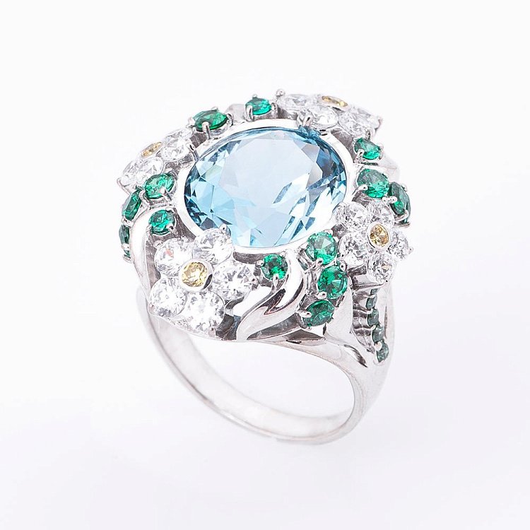 Золота каблучка з топазом і кольоровими фіанітами 14032088т від ювелірного магазину Онікс