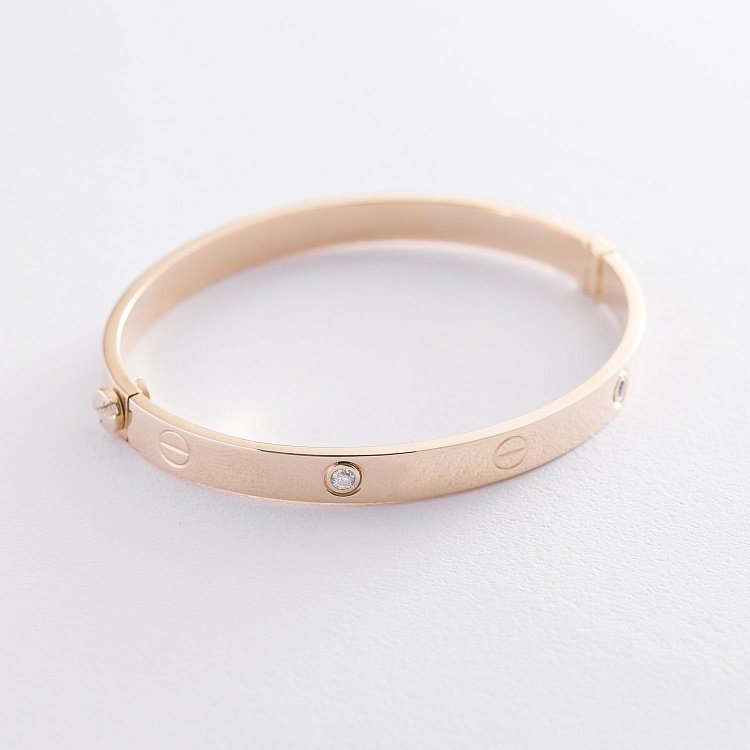 Жесткий браслет из желтого золота б04386 от ювелирного магазина Оникс