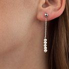 Срібні сережки - пусети з перлами на ланцюжку 2339/1р-PWT от ювелирного магазина Оникс - 5