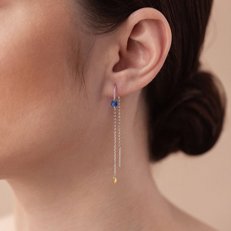 Золоті сережки - протяжки "Українка" (блакитні та жовті фіаніти) с08390 від ювелірного магазину Онікс