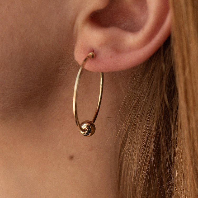 Сережки - кільця Гармонія у жовтому золоті с07315 від ювелірного магазину Онікс - 1